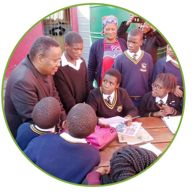 Rev Chikane explaining June the 16th uprising to kids at a Makana orphanage.